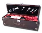 Our Sommelier Wine Box is the gift of elegance. Handsome piano finish mahogany wood encases a soft red, pillowy satin bed for your wine of choice. A complete tool set in the lid includes opener, nozzle, stopper and foil knife.